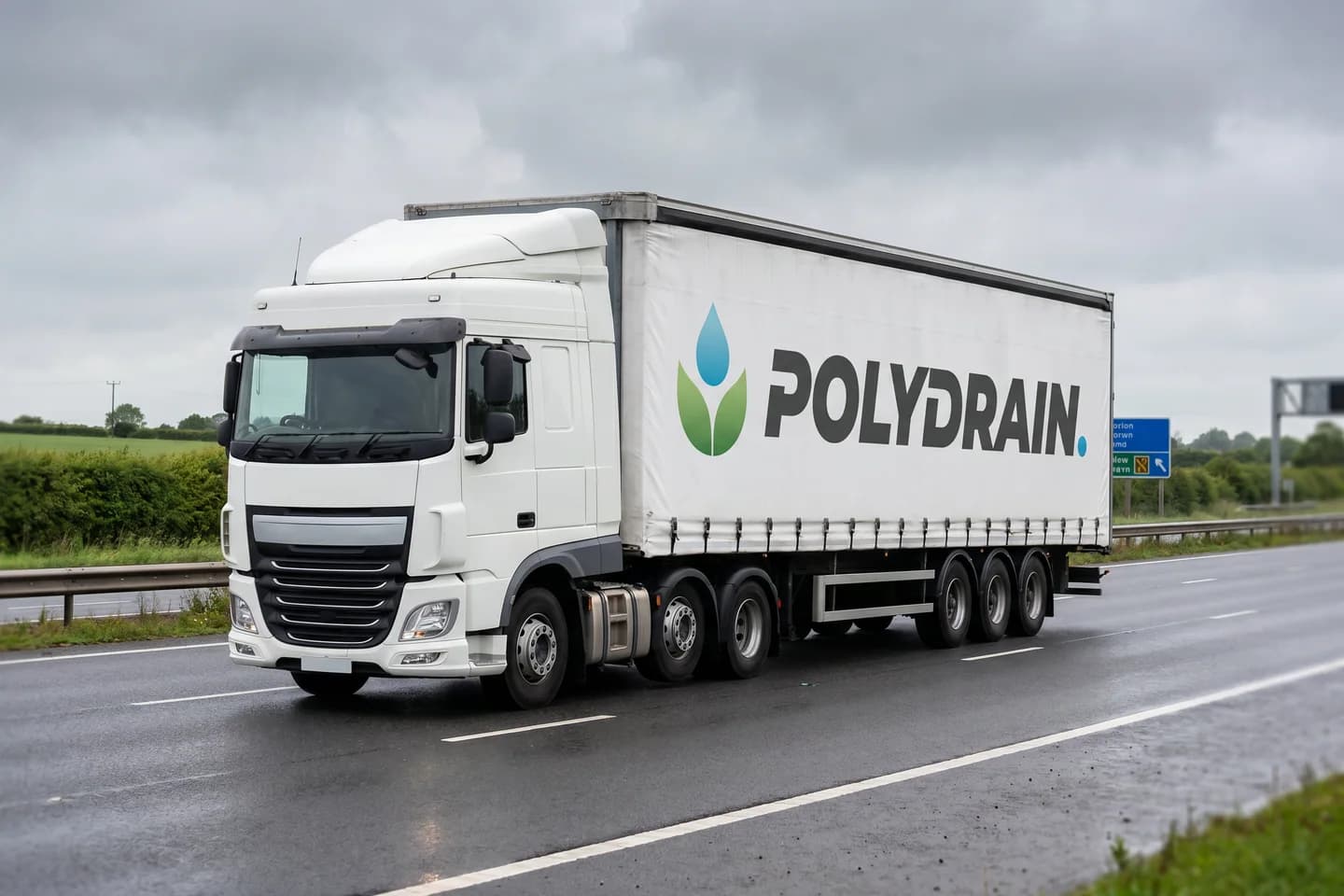 A Polydrain-branded curtainside lorry on the motorway